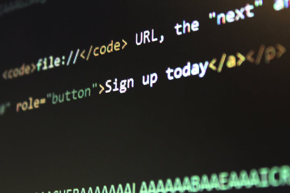 The image displays a computer screen filled with lines of code in HTML markup language, featuring a black background with yellow and orange syntax highlighting. Visible elements include tags such as &